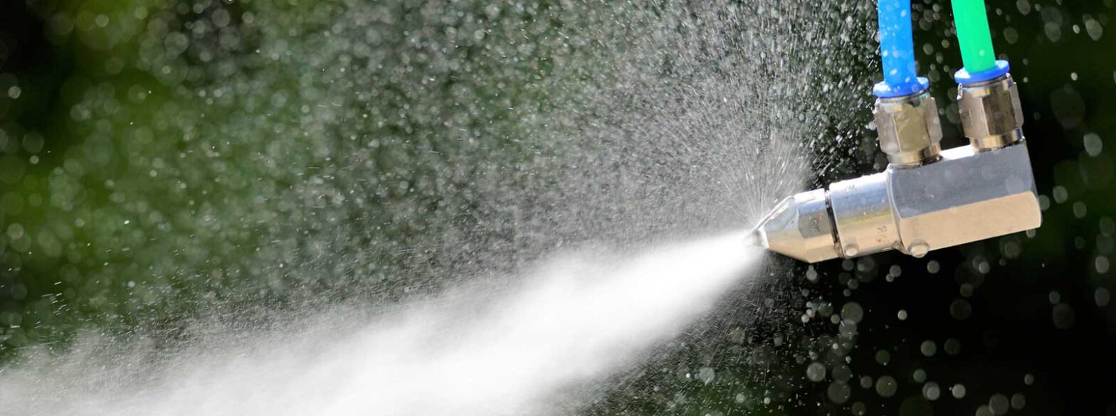 Dust control sprayer in action image